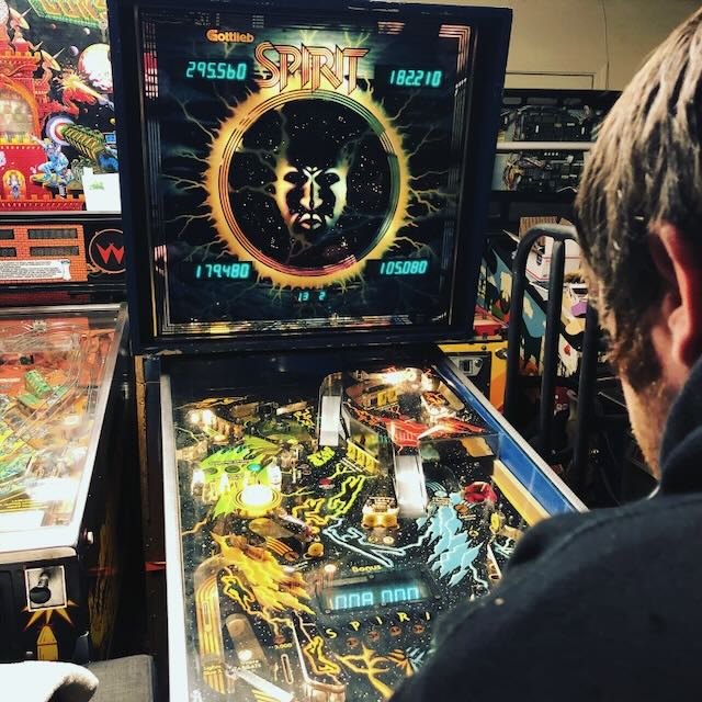 Two machines side by side with scores showing on the displays mid-game