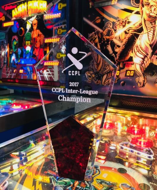 The 2017 CCPL Inter-League Champion trophy standing on a lit playfield