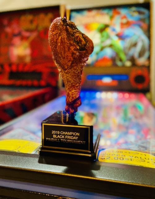 The Black Friday champion trophy, topped with a turkey leg, on a playfield